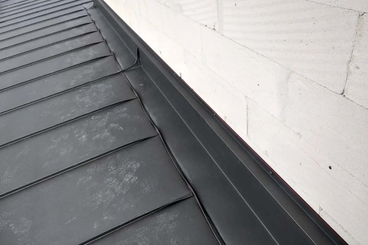 A large commercial flat roof with rooflights