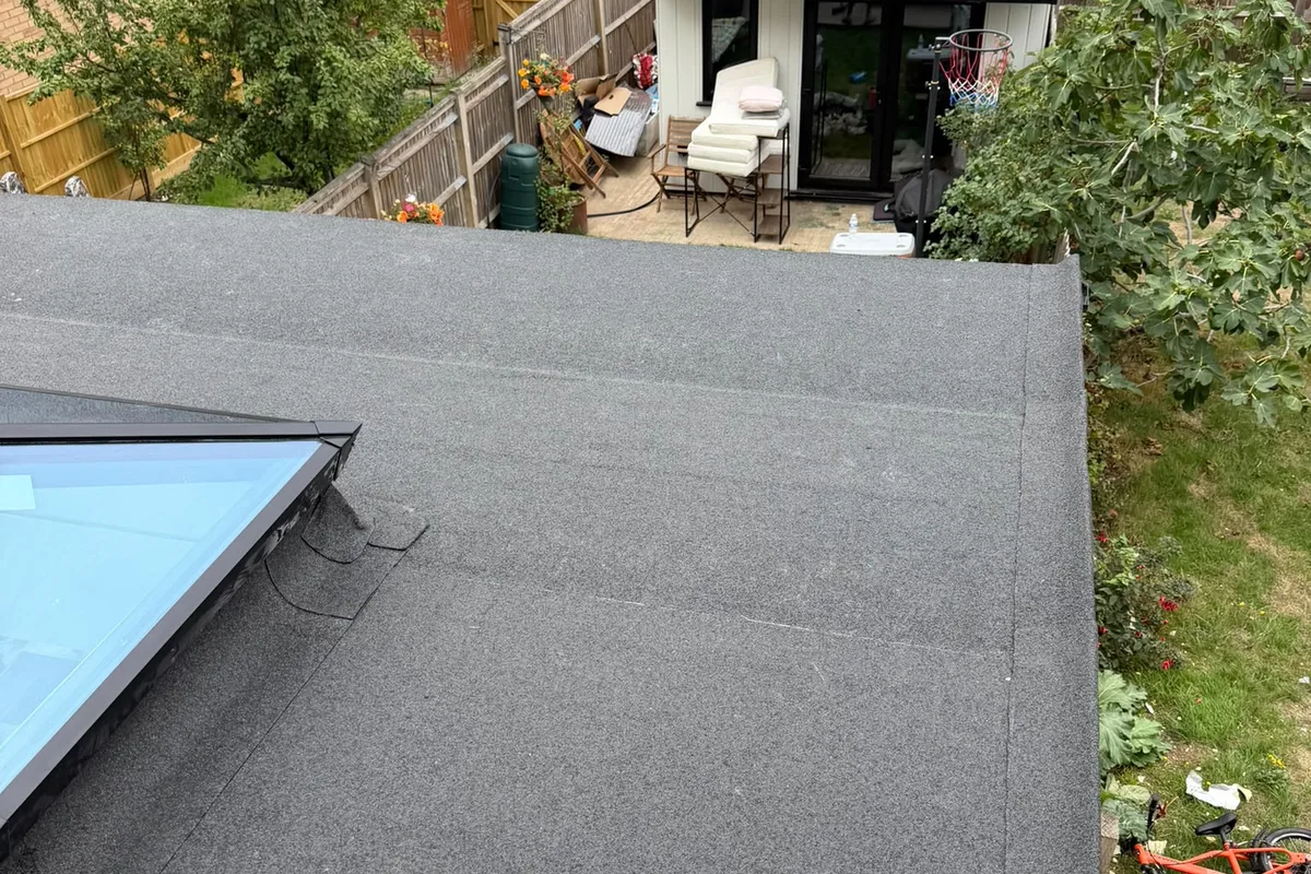 A new felt flat roof looking out over a West London back garden