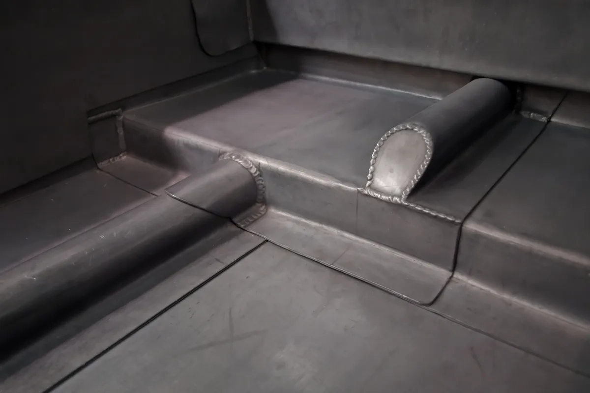 A dressed lead detail at a flat roof upstand