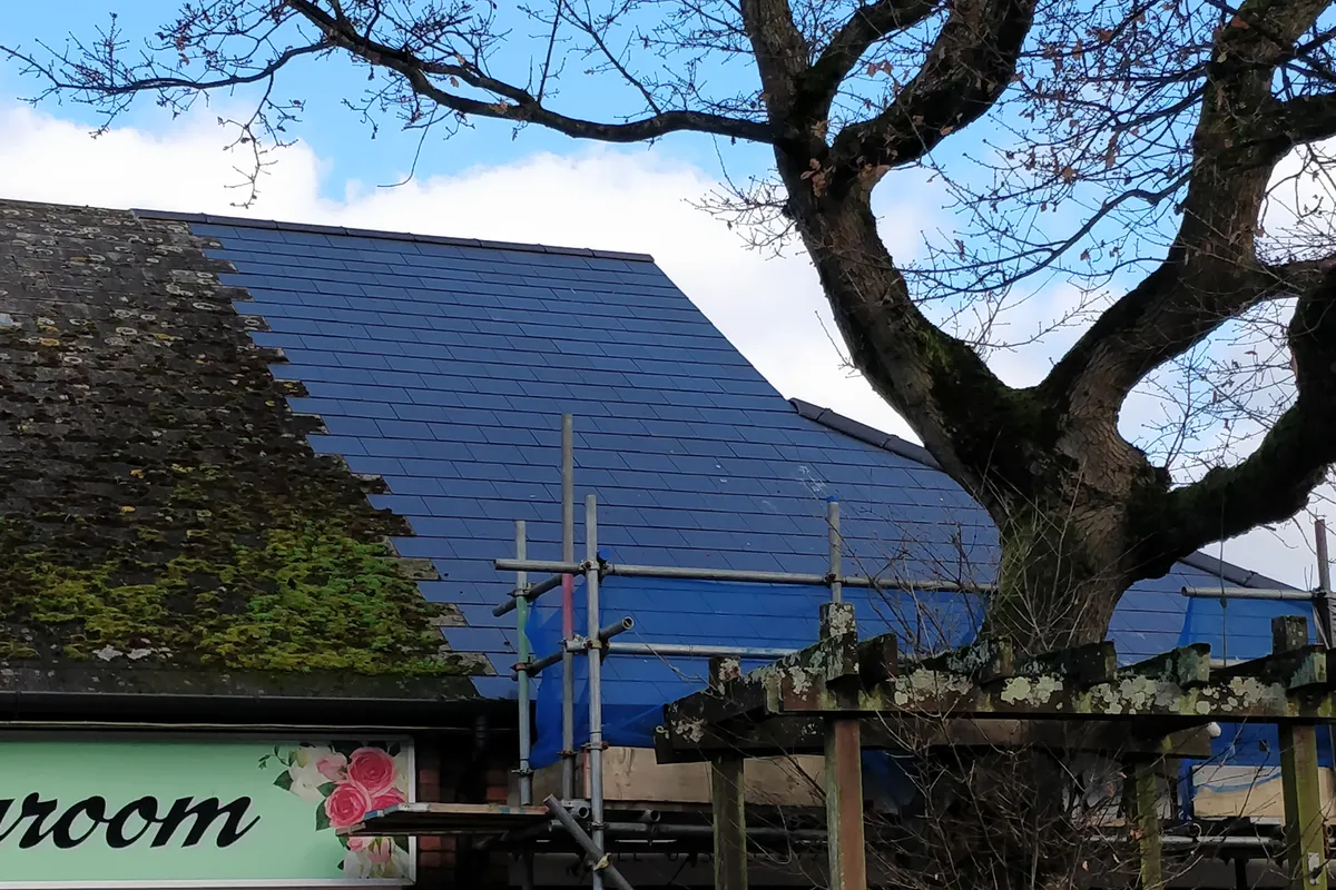 A slate roof cleaned back after moss removal