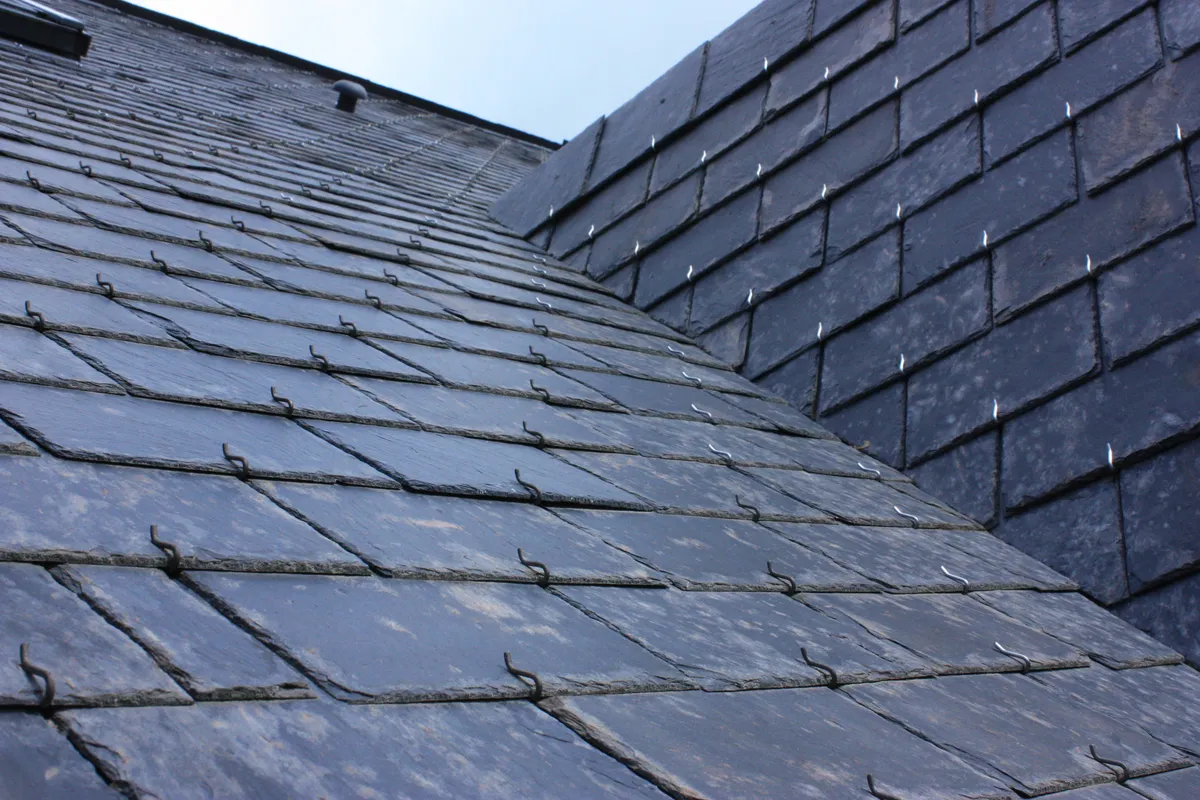 A slate roof and hip meeting at a clean mitre