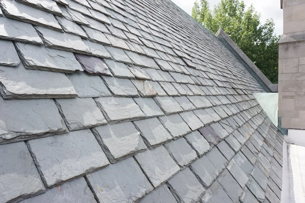 Natural slate laid to a hip on a period roof