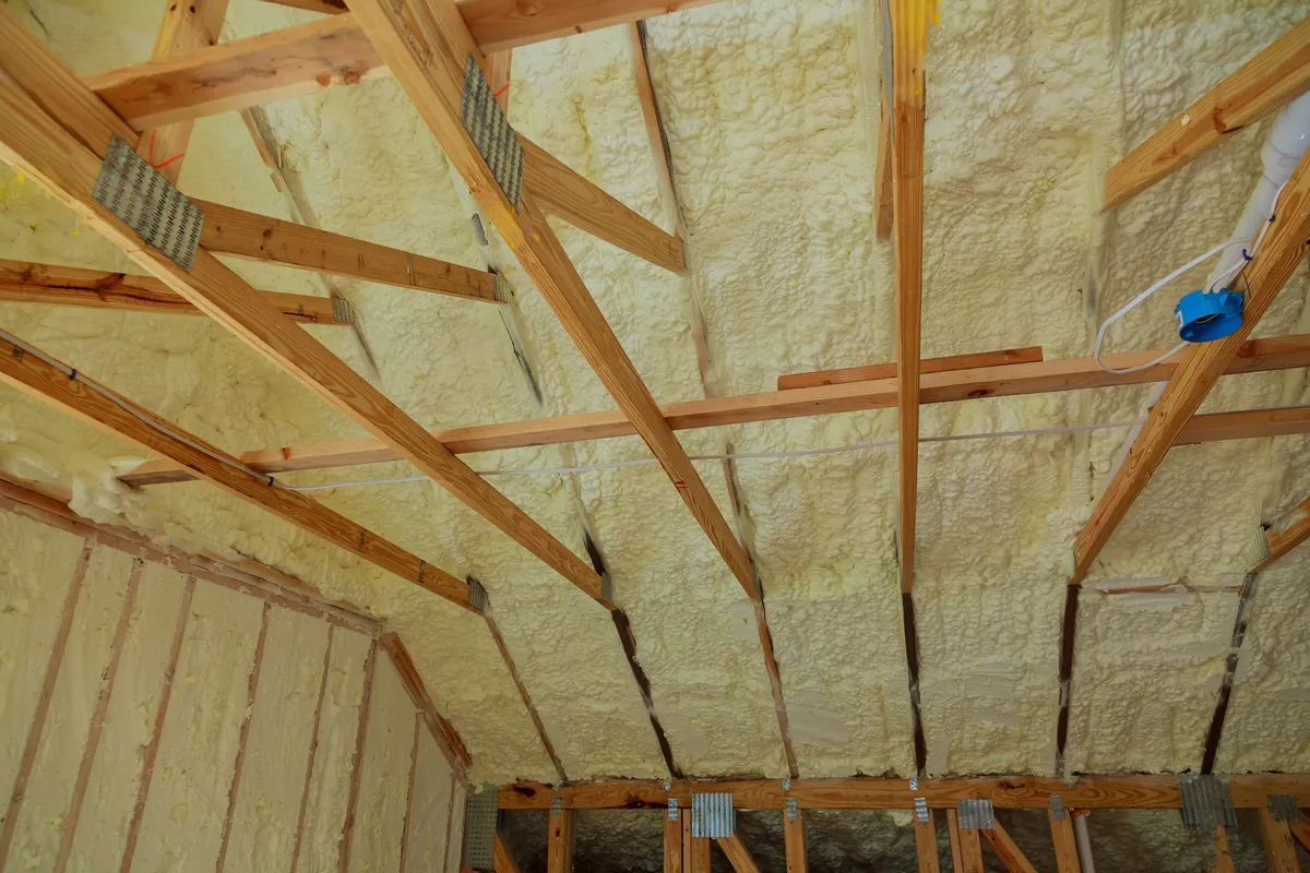 A loft roof slope completely encapsulated in spray foam