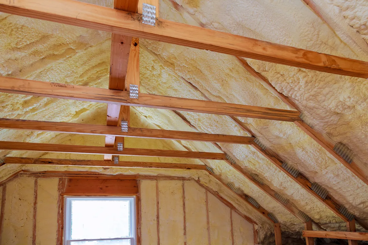 Spray foam covering the rafters and gable right across a loft