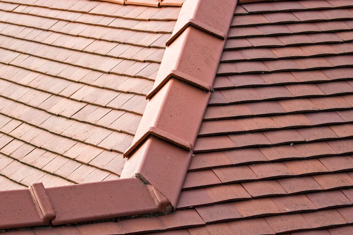 Clay tiles and a bedded ridge on a finished pitched roof
